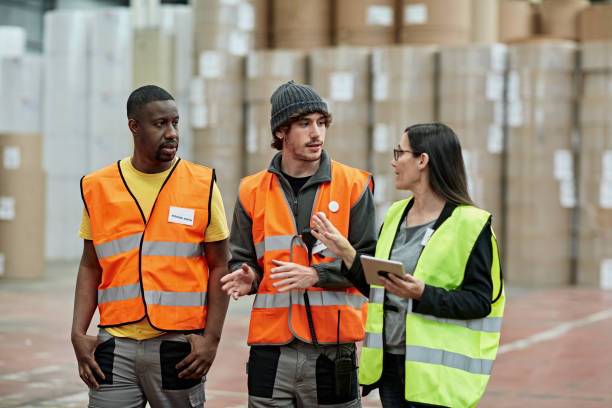 Why are safety vests important in a warehouse?